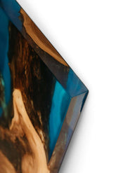 Close-up of wood and blue resin art piece
